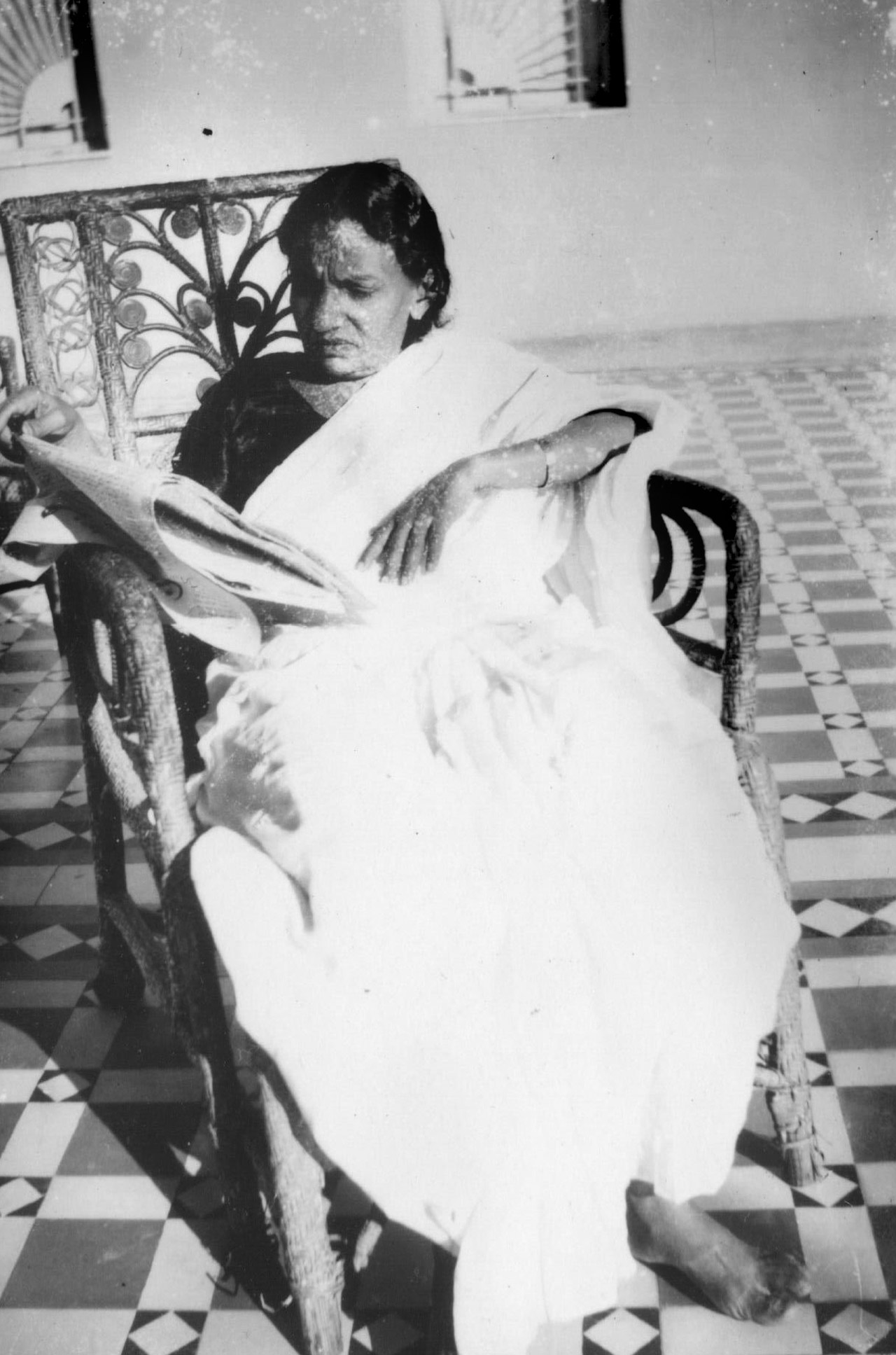 Gomibai Javhermal Shahaney relaxing at home with her newspaper Karachi c1940
